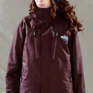 Person wearing maroon jacket and blue beanie.